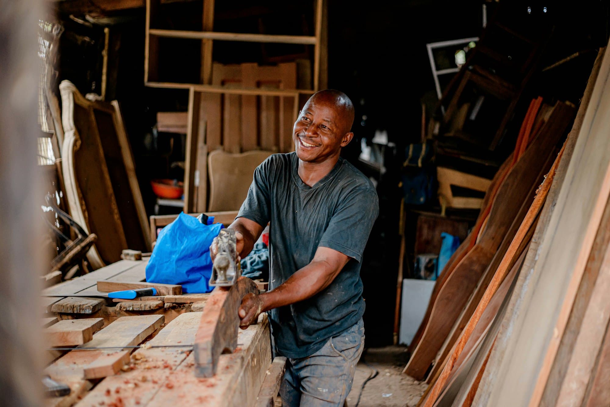 A carpenter at work in a wood shop.